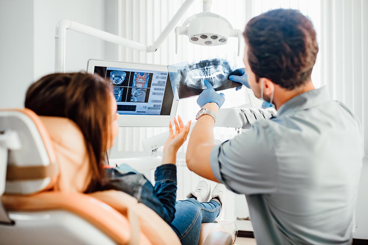 a woman getting x-rays during her saturday dental appointments