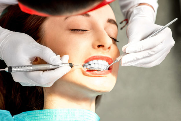 a woman undergoing dental health services