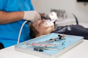 woman receives restorative dentistry services 