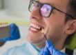 a man is happy to receive his dental implant
