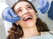 a teen is happy to receive dental braces