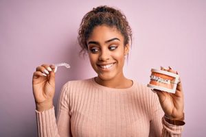 woman shows off her new orthodontics